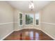 Dining room featuring hardwood floors and a bay window with backyard views at 40 Crepe Myrtle Ct, Angier, NC 27501