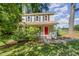 Charming two-story home featuring a bright red front door and covered porch at 40 Crepe Myrtle Ct, Angier, NC 27501