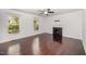 Bright living room with hardwood floors, neutral paint, fireplace, and lots of natural light at 40 Crepe Myrtle Ct, Angier, NC 27501