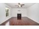 Bright living room has hardwood floors, neutral paint, a fireplace, and a ceiling fan at 40 Crepe Myrtle Ct, Angier, NC 27501