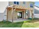 Back patio with pergola, sliding glass door, and white vinyl fence at 4109 Massey Preserve Trl, Raleigh, NC 27616
