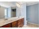 Bathroom features double sinks, vanity with drawers, a large mirror, and modern fixtures at 4109 Massey Preserve Trl, Raleigh, NC 27616