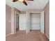 Bedroom with neutral carpet, ceiling fan, and a view of walk-in closet at 4109 Massey Preserve Trl, Raleigh, NC 27616