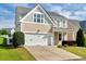 Charming two-story home featuring a two-car garage and well-maintained lawn at 4109 Massey Preserve Trl, Raleigh, NC 27616