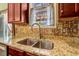 Close up of Kitchen featuring stainless steel double sink and granite counter at 4109 Massey Preserve Trl, Raleigh, NC 27616