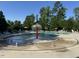 Community pool with splash fountain feature and plenty of seating at 4109 Massey Preserve Trl, Raleigh, NC 27616