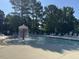 Community pool with splash fountain and lounge chairs on a sunny day at 4109 Massey Preserve Trl, Raleigh, NC 27616