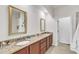 Elegant bathroom with dual sinks, granite countertops, and framed mirrors at 416 Durants Neck Ln, Morrisville, NC 27560