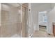 Well-lit bathroom featuring a glass shower and a view of the bedroom at 416 Durants Neck Ln, Morrisville, NC 27560
