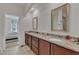 Bathroom featuring granite countertops, wood cabinets, and a view into the bedroom at 416 Durants Neck Ln, Morrisville, NC 27560