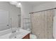 Bright bathroom features a single sink vanity and a shower with dragonfly-patterned curtain at 416 Durants Neck Ln, Morrisville, NC 27560