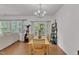 Comfortable dining room area with natural light, hardwood flooring, and modern chandelier at 416 Durants Neck Ln, Morrisville, NC 27560