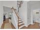 Bright entryway with a staircase, hardwood floors, and access to other rooms at 416 Durants Neck Ln, Morrisville, NC 27560