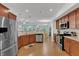 Eat in kitchen featuring stainless steel appliances and granite countertops with view to dining area at 416 Durants Neck Ln, Morrisville, NC 27560