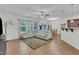 Inviting living room with a cozy sectional sofa, hardwood floors, and natural light at 416 Durants Neck Ln, Morrisville, NC 27560