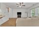 Comfortable living room with a neutral sofa, hardwood floors, and an open layout at 416 Durants Neck Ln, Morrisville, NC 27560