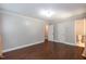 Bedroom with hardwood floors, crown molding, two closets, and an en suite bathroom at 4221 River Run Dr, Sanford, NC 27332