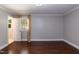 Bedroom with hardwood floors, neutral paint, and a window offering natural light at 4221 River Run Dr, Sanford, NC 27332