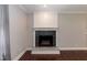 Detailed view of the living room fireplace with dark tile surround and decorative mantel at 4221 River Run Dr, Sanford, NC 27332