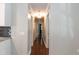 Long hallway with hardwood floors provides access to different areas of the house at 4221 River Run Dr, Sanford, NC 27332