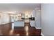 Modern kitchen with white cabinets, granite countertops, stainless steel appliances, and hardwood floors at 4221 River Run Dr, Sanford, NC 27332