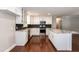 Spacious kitchen features white cabinets, a large island, stainless steel appliances, and granite countertops at 4221 River Run Dr, Sanford, NC 27332