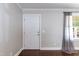Bright and spacious living room with hardwood floors and large window with backyard view at 4221 River Run Dr, Sanford, NC 27332