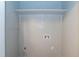 A laundry or storage room features a shelf, utility hookups, and electrical outlet at 4221 River Run Dr, Sanford, NC 27332