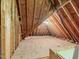 Unfinished attic space framed with wooden beams and plywood subflooring, offering expansion potential at 445 Ridge Springs Dr, Chapel Hill, NC 27516