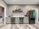 Home bar area showcasing built-in wine coolers, cabinets, and countertops at 445 Ridge Springs Dr, Chapel Hill, NC 27516