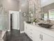Elegant bathroom with a double vanity, modern sinks, and mosaic tile backsplash at 445 Ridge Springs Dr, Chapel Hill, NC 27516