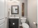 Stylish half bathroom with modern vanity, fixtures, and decorative accents creating a sophisticated space at 445 Ridge Springs Dr, Chapel Hill, NC 27516