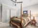 This bedroom offers a four-poster bed with soft, neutral colors and ample natural light at 445 Ridge Springs Dr, Chapel Hill, NC 27516