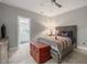 Cozy bedroom features a comfortable bed, a dresser, neutral walls, and a doorway to the bathroom at 445 Ridge Springs Dr, Chapel Hill, NC 27516