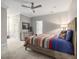 Spacious bedroom with soft, neutral colors, a ceiling fan, artwork, and dresser at 445 Ridge Springs Dr, Chapel Hill, NC 27516