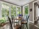 Inviting breakfast nook with multiple windows, perfect for enjoying morning coffee and nature views at 445 Ridge Springs Dr, Chapel Hill, NC 27516