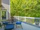 Outdoor deck with table and chairs, perfect for enjoying the surrounding nature views at 445 Ridge Springs Dr, Chapel Hill, NC 27516