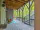 Outdoor deck with chairs, a rug, and stairs leading to the yard at 445 Ridge Springs Dr, Chapel Hill, NC 27516