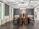 Dining room with coffered ceilings, decorative mirror, and contemporary light fixture at 445 Ridge Springs Dr, Chapel Hill, NC 27516