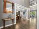 Elegant foyer with hardwood floors and views into the dining and living areas of the house at 445 Ridge Springs Dr, Chapel Hill, NC 27516