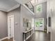 Elegant foyer with soaring ceilings, gleaming hardwood floors, and ample natural light from large windows at 445 Ridge Springs Dr, Chapel Hill, NC 27516