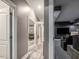 Hallway leading to a living room with modern decor and comfortable seating in a basement space at 445 Ridge Springs Dr, Chapel Hill, NC 27516