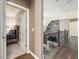 Hallway with hardwood floors leads to a bedroom and overlooks the open-concept living area below at 445 Ridge Springs Dr, Chapel Hill, NC 27516