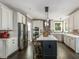 The kitchen features a large island, stainless appliances, and plenty of cabinet space at 445 Ridge Springs Dr, Chapel Hill, NC 27516