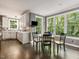 Cozy kitchen with breakfast nook, ample windows, and stainless steel appliances at 445 Ridge Springs Dr, Chapel Hill, NC 27516