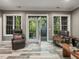 Bright living room with beautiful french doors leading to a deck at 445 Ridge Springs Dr, Chapel Hill, NC 27516