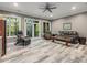 Comfortable living room with neutral tones, wood-look floors, and natural light at 445 Ridge Springs Dr, Chapel Hill, NC 27516