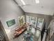 Spacious living room features hardwood floors, a fireplace, large windows, and an open floor plan at 445 Ridge Springs Dr, Chapel Hill, NC 27516