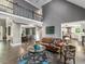 Open-concept living room with balcony, dining area, and kitchen, perfect for modern living at 445 Ridge Springs Dr, Chapel Hill, NC 27516