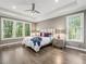 Spacious main bedroom boasts tray ceilings, hardwood floors, and abundant natural light at 445 Ridge Springs Dr, Chapel Hill, NC 27516